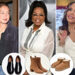 Bota preta de couro até o joelho com salto bloco.