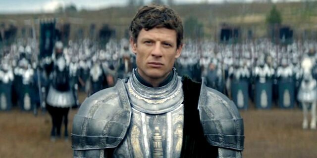 A man in armor stands before an army