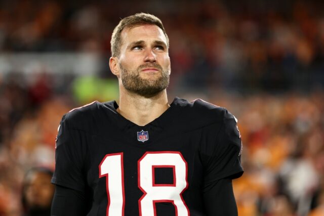 Kirk Cousins #18 of the Atlanta Falcons stands on the sidelines during the national anthem prior to the NFL football game against the Tampa Bay Buccaneers at Raymond James Stadium on December 11, 2025 in Tampa, Florida.