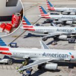 Área de espera vazia do portão do aeroporto com cadeiras e um avião da American Airlines visível ao fundo em Miami, EUA.