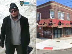 Intolerante cheio de ódio danifica menorá do lado de fora da despensa de alimentos de Nova York Um homem de gorro preto, óculos escuros, moletom cinza, casaco preto e calça escura carregando uma bolsa escura, andando em uma calçada parcialmente coberta de neve.