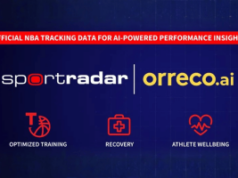 Jogadores da NBA obterão maiores dados biométricos por meio do acordo entre Orreco e Sportradar Jogadores da NBA obterão maiores dados biométricos por meio do acordo entre Orreco e Sportradar. Um gráfico anunciando uma parceria entre Sportradar e Orreco.ai. O banner superior diz “Dados oficiais de rastreamento da NBA para insights de desempenho baseados em IA”. Abaixo estão os logotipos Sportradar e Orreco.ai em um fundo azul escuro. Três ícones vermelhos representam treinamento otimizado, recuperação e bem-estar do atleta.