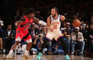 Knicks em liga própria com quartos de 40 pontos Jalen Brunson dribla a bola enquanto Jamal Shead a defende durante um jogo de basquete.