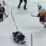 Mat Barzal dá corda para acertar Mason Marchment durante um jogo no domingo.