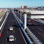 O projeto de US$ 10,2 bilhões promete tirar mais de 9.000 caminhões das estradas locais e economizar aos motoristas até 20 minutos no tempo de viagem quando for inaugurado no domingo.