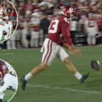 O atacante defensivo do Alabama, Tim Keenan III (96), bloqueia um chute do chutador de Oklahoma Grayson Miller (43) durante um jogo de futebol.