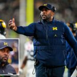 Sherrone Moore, técnico do Michigan Wolverines, gesticula em campo.