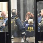 'Pessoa de interesse' detida em tiroteio na Universidade de Brown, bloqueio suspenso