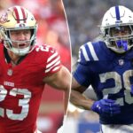 Christian McCaffrey, nº 23 do San Francisco 49ers, comemora com seus companheiros de equipe após marcar um touchdown.