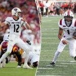 Jogador nº 1 do Arkansas State correndo com futebol contra o Arkansas.