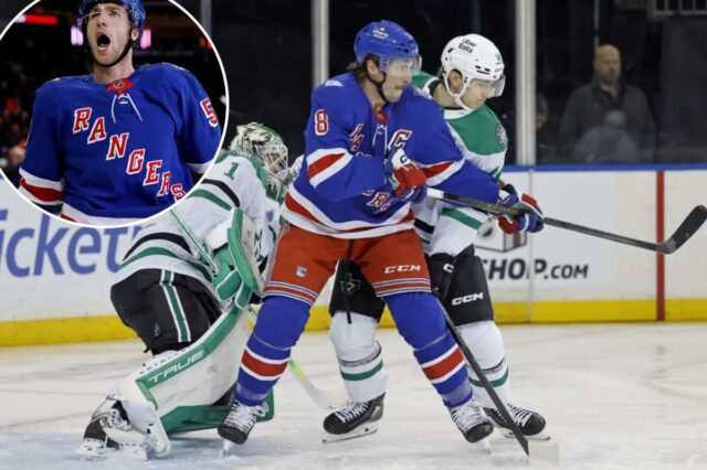 JT Miller luta por posição com Ilya Lyubushkin durante a vitória do Rangers no OT sobre os Stars em 2 de dezembro de 2025.