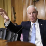 FILE - A healthcare worker prepares a shot of the Pfizer COVID-19 vaccine in La Paz, Bolivia, Jan. 7, 2025. (AP Photo/Juan Karita, File)