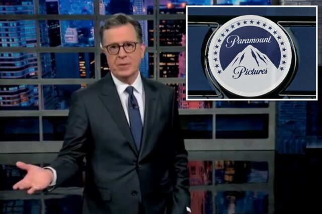 Stephen Colbert argumenta que a oferta de US$ 108 bilhões Stephen Colbert de terno gesticulando com a mão esquerda em frente ao horizonte da cidade.