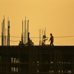 Men work at under construction site in New Delhi