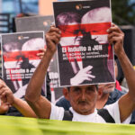 ARQUIVO - O presidente de Honduras, Juan Orlando Hernandez, fala durante a cerimônia de abertura da Conferência das Nações Unidas sobre Mudanças Climáticas COP26 em Glasgow, Escócia, segunda-feira, 1º de novembro de 2021. Andy Buchanan/Pool via AP, Arquivo)