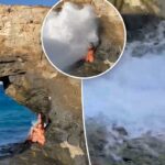 Turista glamorosa quase morta depois que uma onda gigante a jogou contra as rochas durante a sessão de fotos