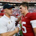 Clark Lea of the Vanderbilt Commodores talks with Ty Simpson #15 of the Alabama Crimson Tide