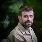 Wayne Rooney cobrindo a Liga dos Campeões em Anfield