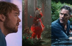 14 dos filmes mais badalados à venda no Sundance Uma fantasia de mascote de uniforme laranja fica enfaixada e ensanguentada na floresta com um machado