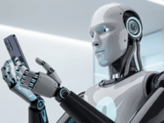 A IA agora alimenta quase metade de todas as apostas, segundo novo relatório Um elegante robô humanóide de IA com painéis cromados polidos e preto fosco segura um smartphone moderno em seus dedos metálicos articulados. O robô possui tiras de LED azuis brilhantes ao longo de suas juntas e um painel frontal liso e inexpressivo que reflete a luz da tela do telefone. Sua postura é suave e precisa ao embalar o dispositivo, com servomecanismos visíveis e detalhes de cabos adicionando autenticidade mecânica. O fundo é um ambiente de laboratório de tecnologia limpo e minimalista, com iluminação branca suave que destaca as superfícies reflexivas do robô e o design elegante do telefone. A IA agora alimenta quase metade de todas as apostas, segundo novo relatório