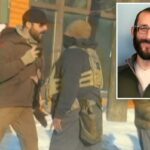 Captura de tela de um vídeo mostrando Alex Pretti (L) e um agente federal de imigração (C) antes de Pretti ser morto a tiros.