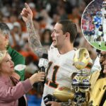 Carson Beck, número 11 do Miami Hurricanes, marca um touchdown contra o Ole Miss Rebels durante a semifinal do College Football Playoff de 2025.