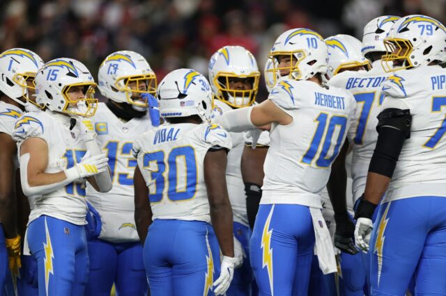FOXBOROUGH, MASSACHUSETTS - JANUARY 11: Justin Herbert #10 of the Los Angeles Chargers in action during the AFC Wild Card Playoff game against the New England Patriots at Gillette Stadium on January 11, 2026 in Foxborough, Massachusetts. (Photo by Sarah Stier/Getty Images)