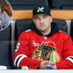 Alex Bregman assistindo a um jogo da NHL entre Chicago Blackhawks e Edmonton Oilers.