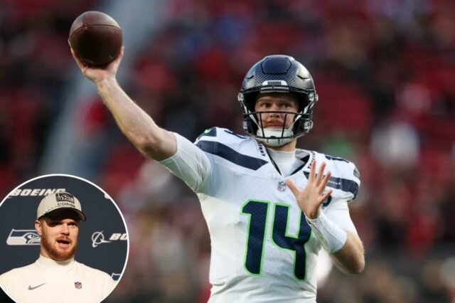 O quarterback do Seattle Seahawks, Sam Howell, vestindo a camisa 14, lançando um passe.