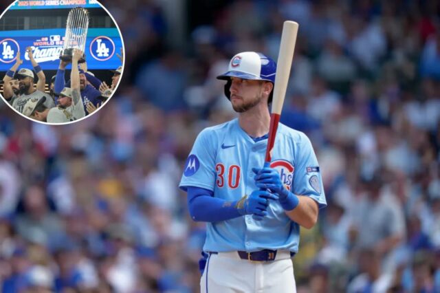 O jogador do Pittsburgh Pirates, PJ Higgins, usando capacete azul e branco e camisa azul claro, segurando um taco.