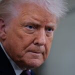 Donald Trump speaks to reporters on board Air Force One while flying in between Ireland and Washington as he returns from the World Economic Forum on January 22, 2026.