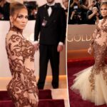 Jennifer Lopez exibe curvas sérias em um vestido de sereia transparente no tapete vermelho do Globo de Ouro de 2026