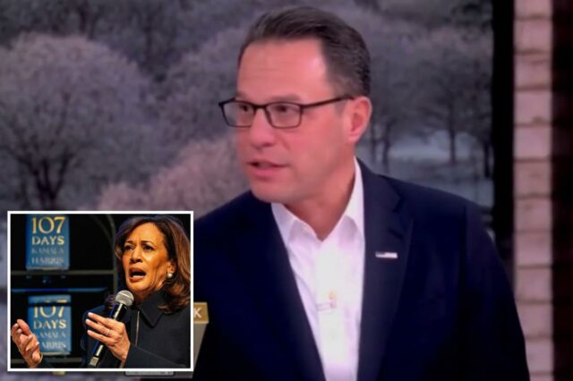 Josh Shapiro de terno e óculos 