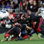 The San Francisco 49ers tackle Kenneth Walker III of the Seattle Seahawks during the game at Levi's Stadium on January 3, 2026 in Santa Clara, California. The Seahawks defeated the 49ers 13-3.