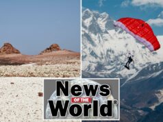 News of the World: O que você perdeu esta semana internacionalmente Dois turistas exploram uma praia rochosa com formações rochosas vermelhas na ilha de Socotra, no Iêmen
