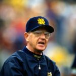 Head Coach Lou Holtz of the Notre Dame Fighting Irish looks on during an NCAA Football game circa 1990. Holtz coached the Notre Dame Fighting Irish from 1986-1996.