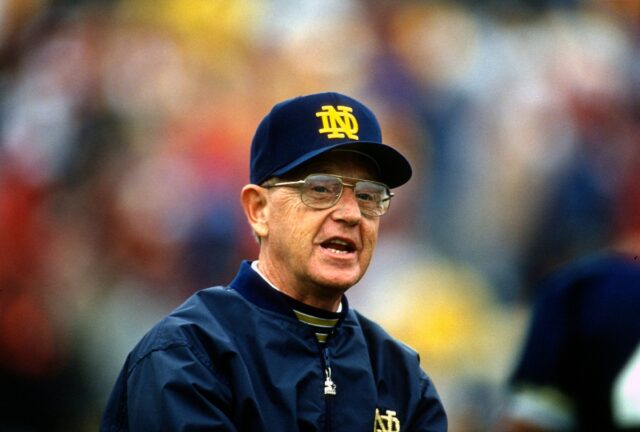 Head Coach Lou Holtz of the Notre Dame Fighting Irish looks on during an NCAA Football game circa 1990. Holtz coached the Notre Dame Fighting Irish from 1986-1996.