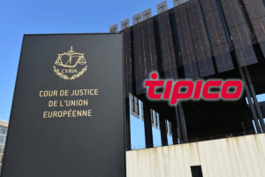 O acerto de contas do jogo online na Alemanha se O acerto de contas do jogo online na Alemanha se aproxima com o caso histórico Tipico. Exterior do edifício do Tribunal de Justiça da União Europeia no Luxemburgo, com o logótipo Tipico sobreposto, simbolizando o histórico caso de jogo alemão perante o TJUE.