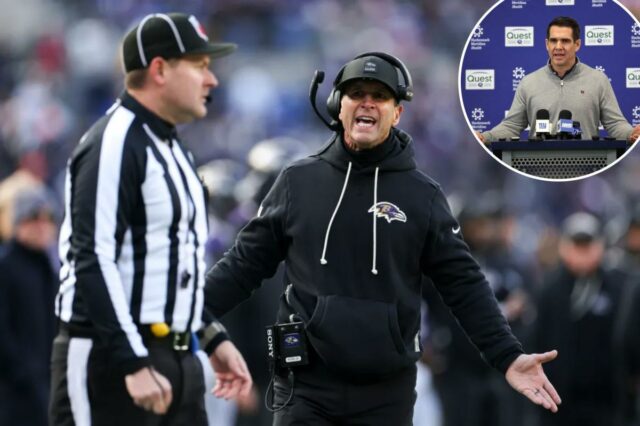 Os fãs dos Giants que desejam a contratação imediata de John Harbaugh discute com um árbitro.