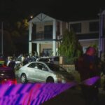 Uma cena de crime em Rebecca Road, em Greenacre, à noite, após uma suposta briga.