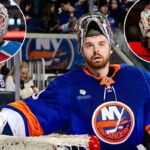 Um goleiro do New York Islanders com uniforme branco e azul faz uma defesa, desviando o disco com o taco.