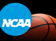 Promotores federais revelam amplo esquema ilegal de manipulação de jogos de basquete da NCAA vinculado à China Promotores federais revelam amplo esquema ilegal de manipulação de jogos de basquete da NCAA vinculado à China. Logotipo da NCAA sobreposto a uma bola de basquete em close-up contra um fundo preto, representando o basquete universitário e a NCAA.