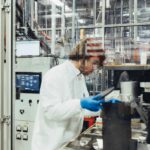 A man works on nuclear fuel in a lab.