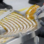 An engineer works on a high-temperature superconducting magnet.