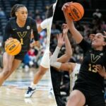 A guarda do Vanderbilt Commodores, Mikayla Blakes (1), contorna a guarda do Michigan Wolverines, Mila Holloway (3), durante a primeira metade do Coretta Scott King Classic no Prudential Center, segunda-feira, 19 de janeiro de 2026, em Newark, NJ.
