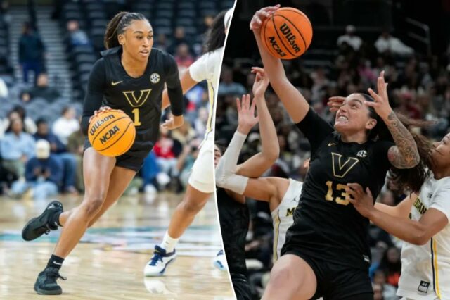 A guarda do Vanderbilt Commodores, Mikayla Blakes (1), contorna a guarda do Michigan Wolverines, Mila Holloway (3), durante a primeira metade do Coretta Scott King Classic no Prudential Center, segunda-feira, 19 de janeiro de 2026, em Newark, NJ. 