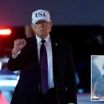 Donald Trump levanta o punho enquanto veste um branco