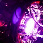 A fusion reactor glows purple.
