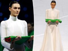 A supermodelo Vittoria Ceretti carrega a bandeira italiana em um vestido Armani branco durante a cerimônia de abertura dos Jogos Olímpicos de Inverno de 2026 A supermodelo Vittoria Ceretti carrega a bandeira italiana em um vestido Armani branco durante a cerimônia de abertura dos Jogos Olímpicos de Inverno de 2026