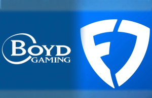 Boyd Gaming relata maior receita em 2025, impulsionada pelo lucro da venda da FanDuel Boyd Gaming relata maior receita em 2025, impulsionada pelo lucro da venda da FanDuel. Gráfico azul mostrando o logotipo da Boyd Gaming à esquerda e um logotipo do escudo FanDuel branco estilizado à direita contra um fundo gradiente azul.